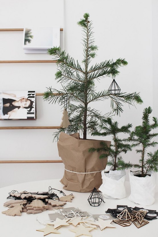 a modern Christmas tree decorated with only white and silver ornaments is a lovely idea for a modern or minimalist space and is very easy to realize - no need to puzzle over its decor